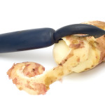 series object on white - kitchen utensil potato peeler